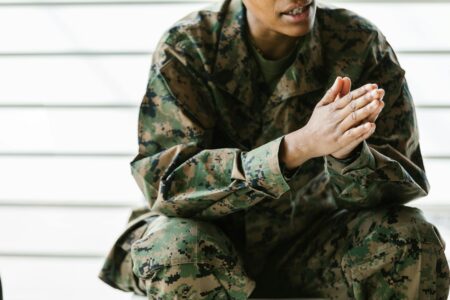 Vintage military jackets and clothing hanging in surplus store