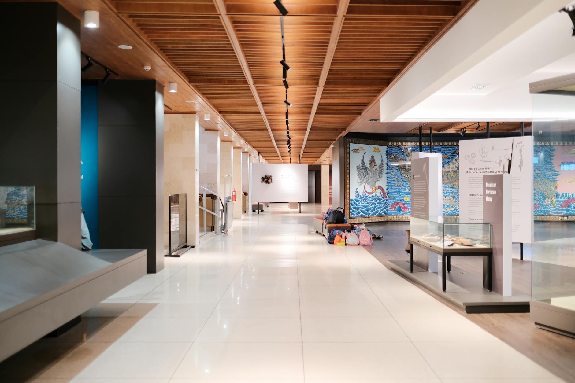 Modern art museum gallery with white walls displaying colorful contemporary artwork