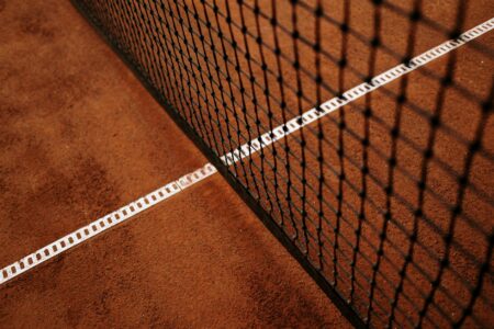 How Pickleball Fashion Became Tennis Country Club’s Status Symbol Well-maintained tennis court at an upscale country club facility