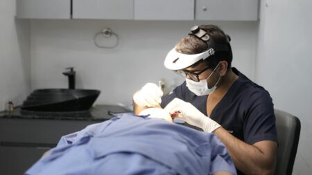 Professional LED light therapy panel in modern dermatology clinic treatment room