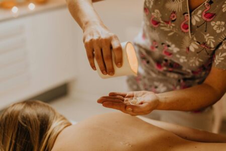 Various essential oils and herbs arranged for Ayurvedic spa treatments