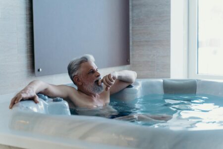 Person preparing for cold water therapy session in clinical setting