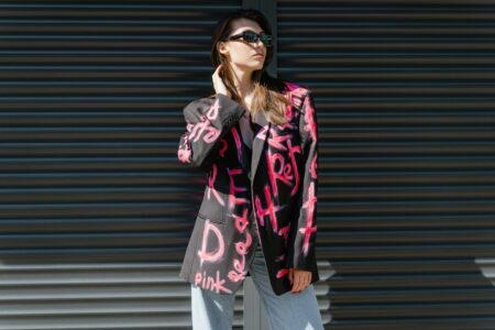 Professional woman wearing an elegant oversized blazer in a modern setting