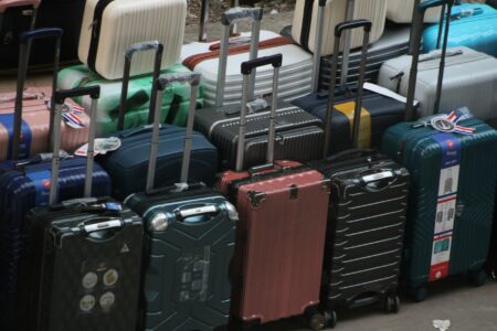 Open suitcase with neatly packed clothing items demonstrating efficient travel packing