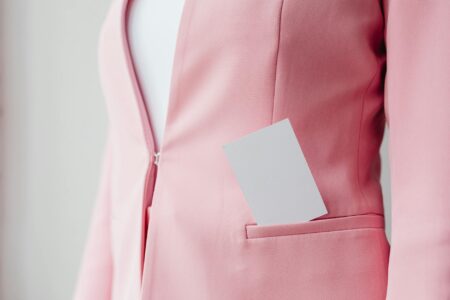 Professional woman wearing a structured blazer in modern office setting