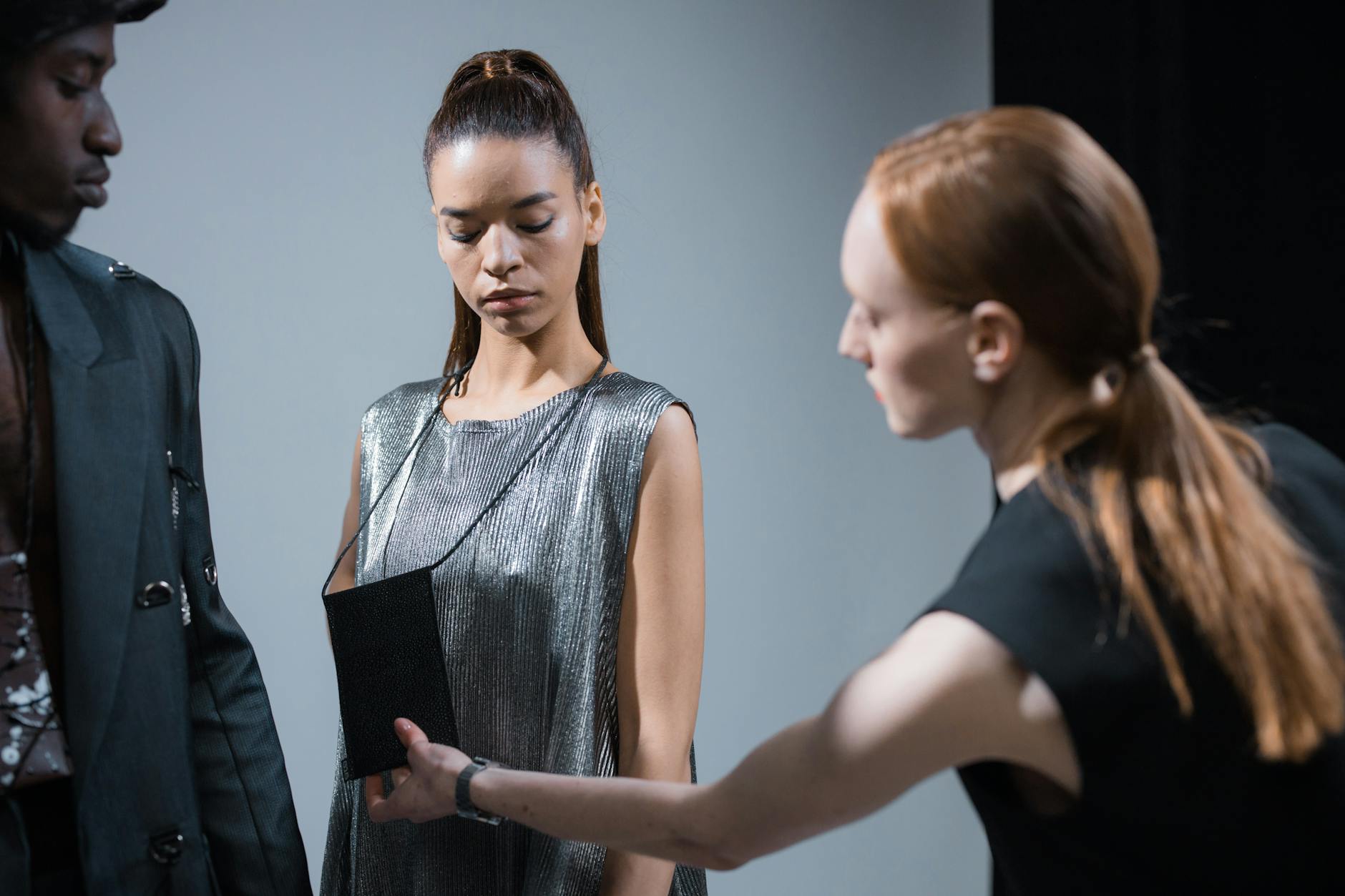 Designer working on deconstructed military garment in fashion studio