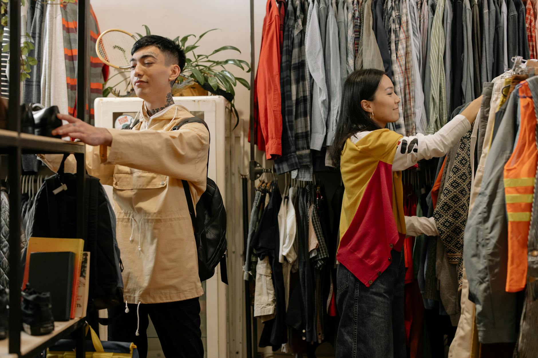 Person browsing through vintage items at a thrift store or flea market