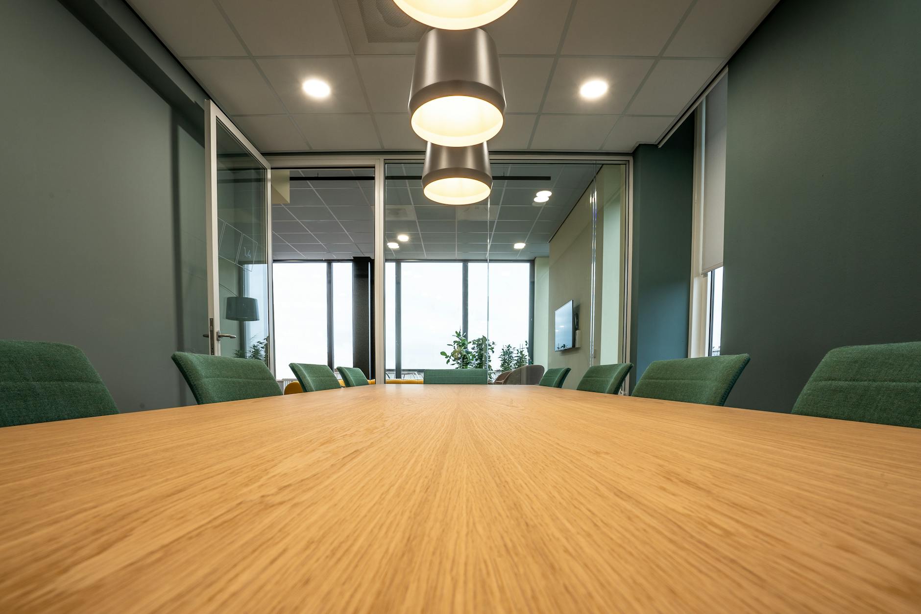 Modern corporate meeting room where professional cardigan styling would be appropriate
