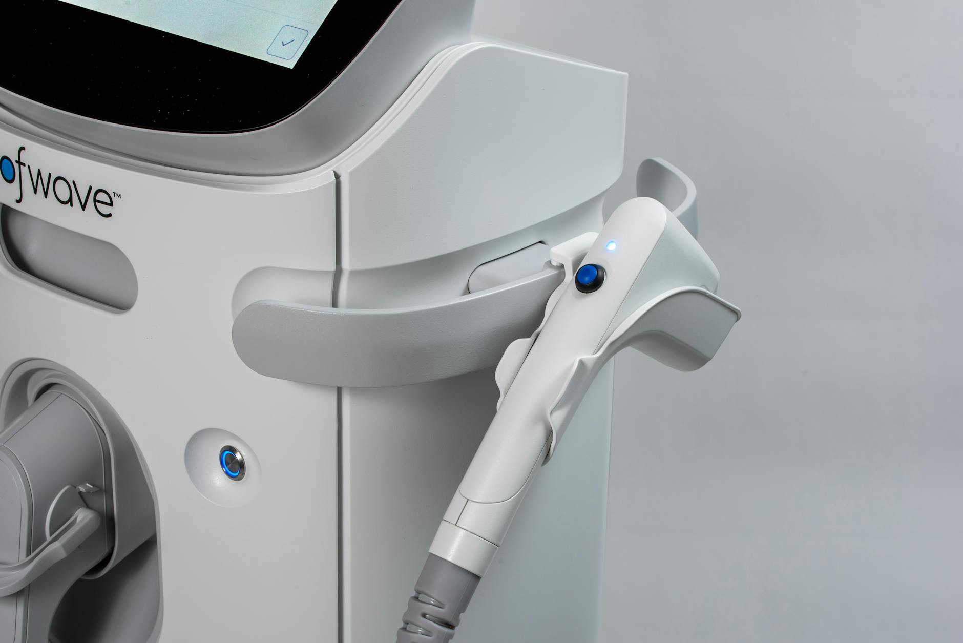 Close-up of LED light therapy device showing blue and red wavelength panels