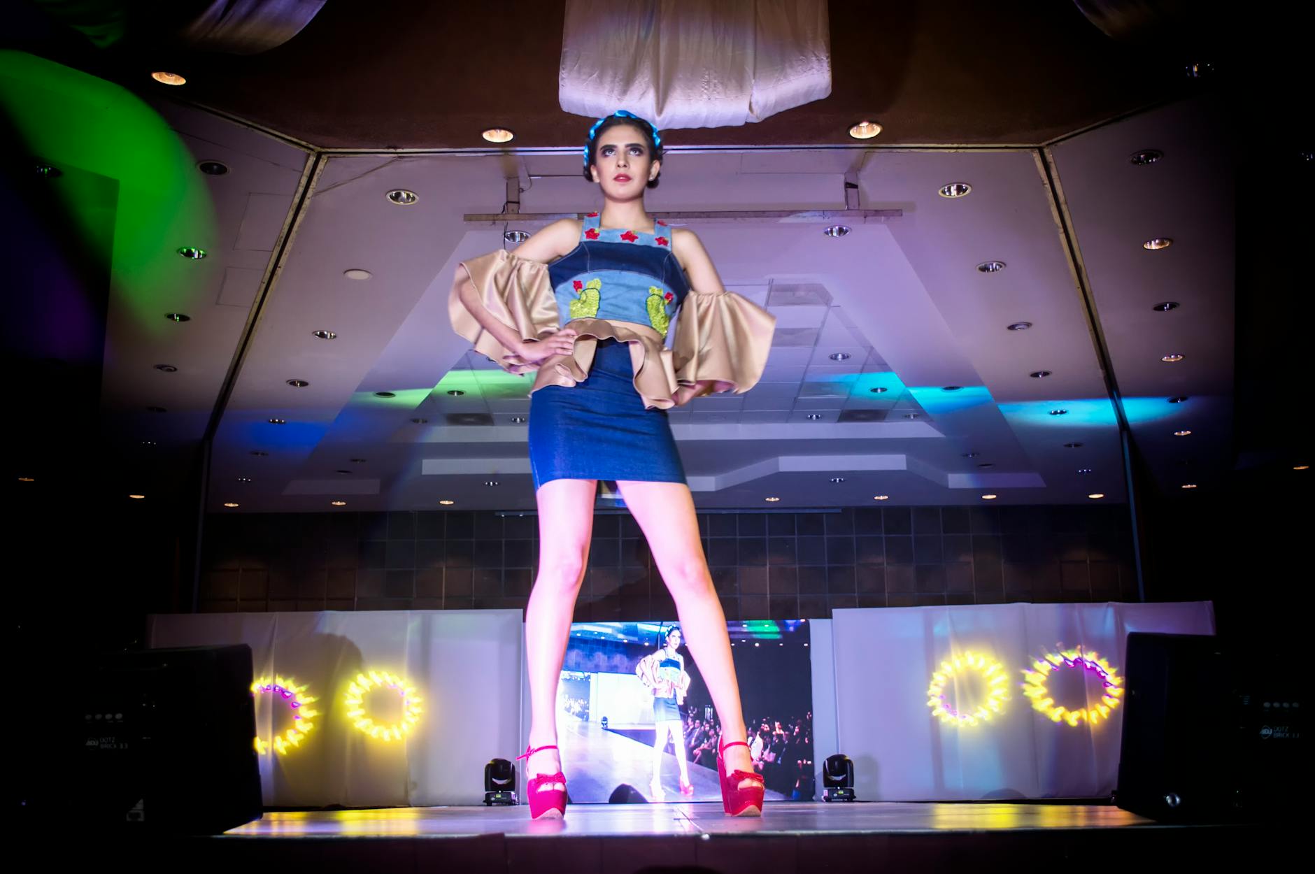 Models walking on fashion runway showcasing contemporary footwear trends