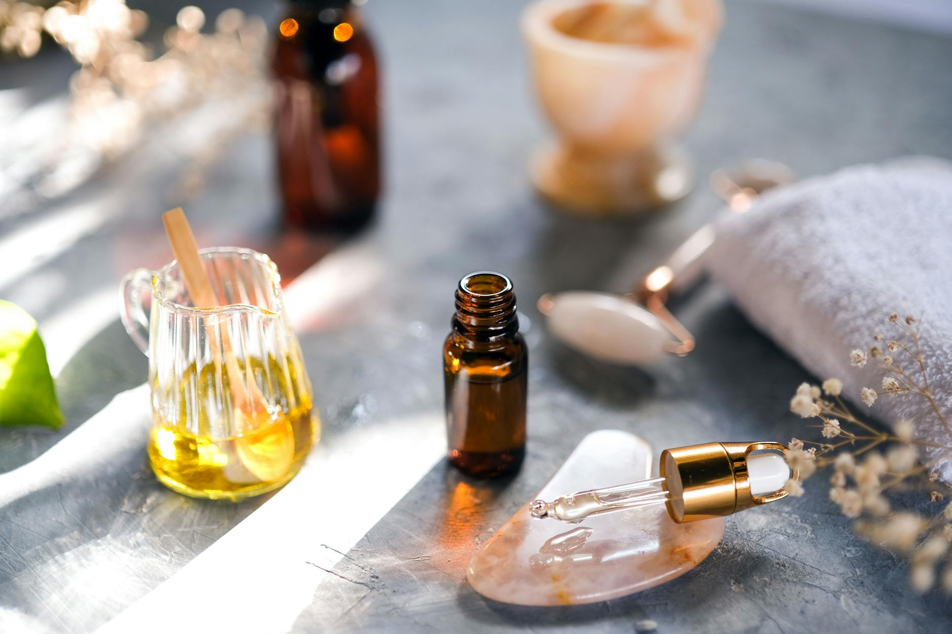 Professional gua sha tools and massage stones arranged for facial treatment