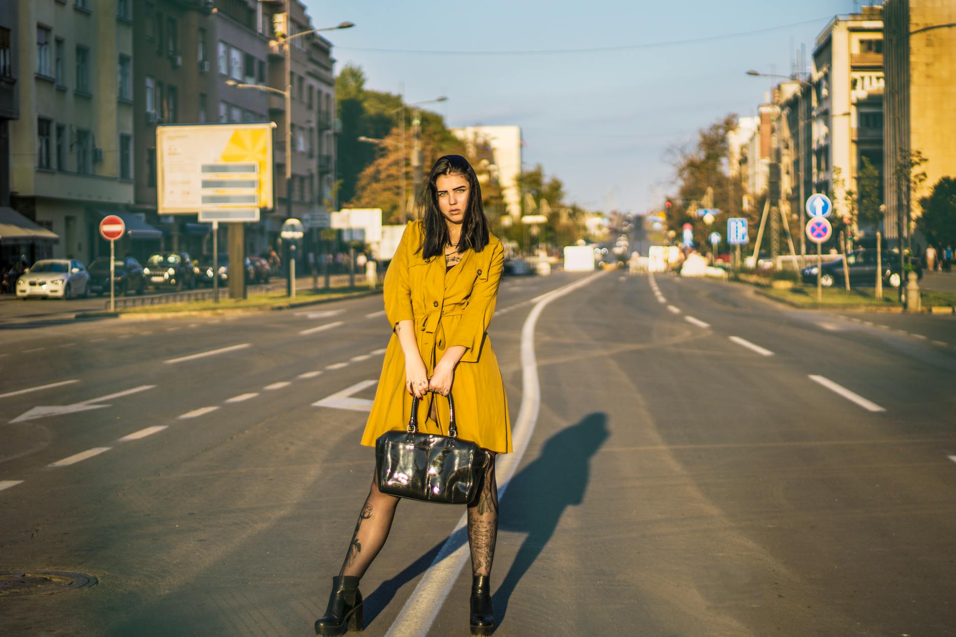 Modern street style outfit incorporating military surplus pieces with contemporary accessories