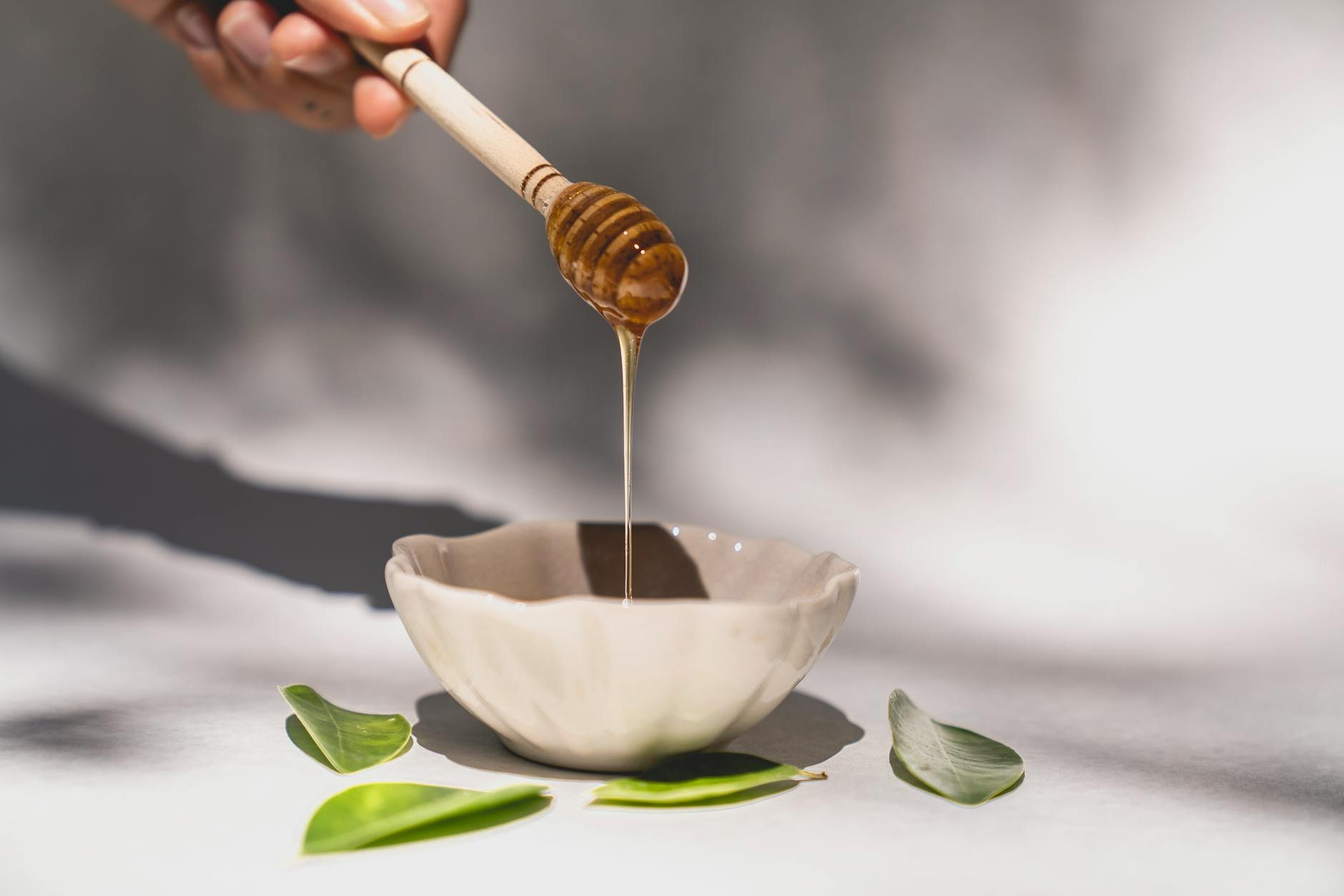Natural honey and organic ingredients in glass containers for cosmetic use
