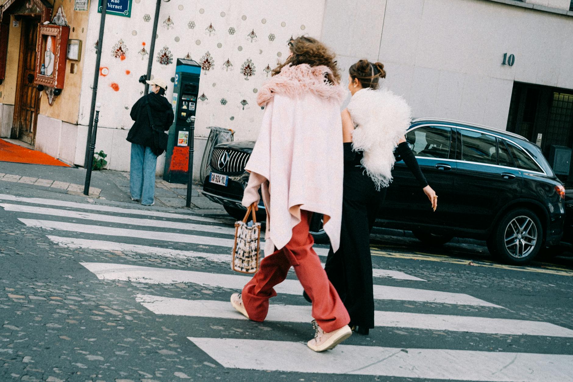 Fashion-forward person showcasing contemporary street style outfit with focus on practical footwear choices