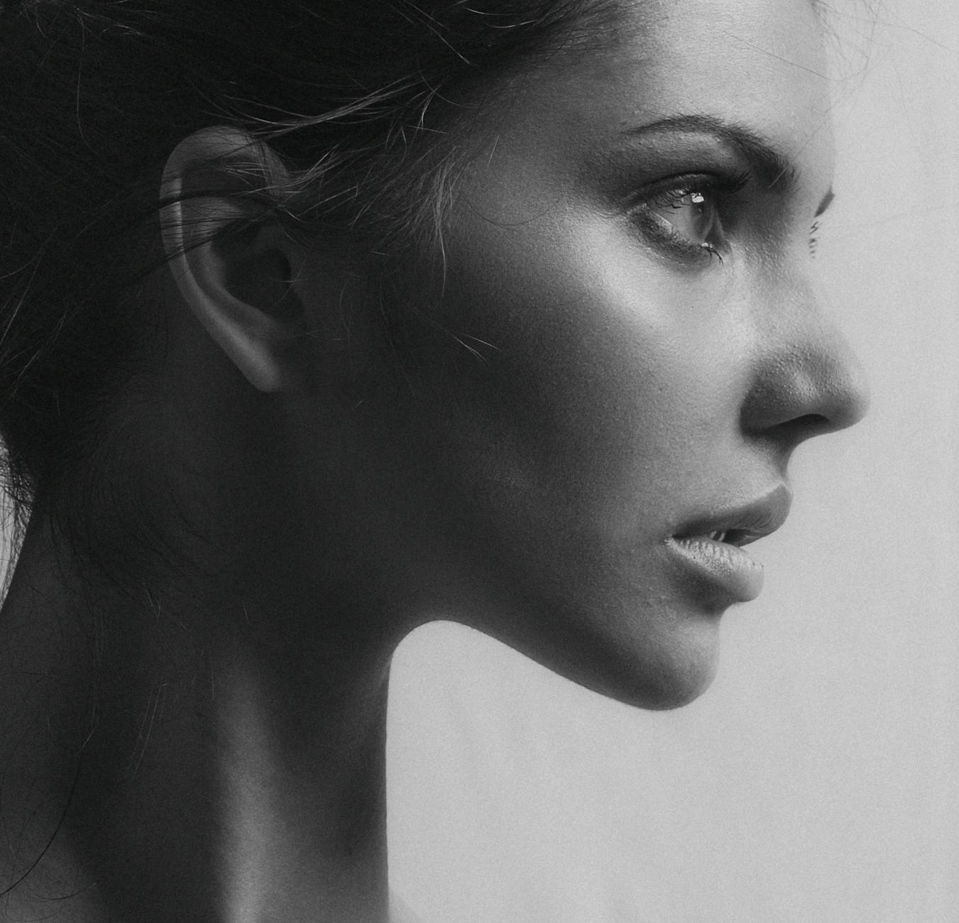 Side profile portrait showing facial features and ear positioning
