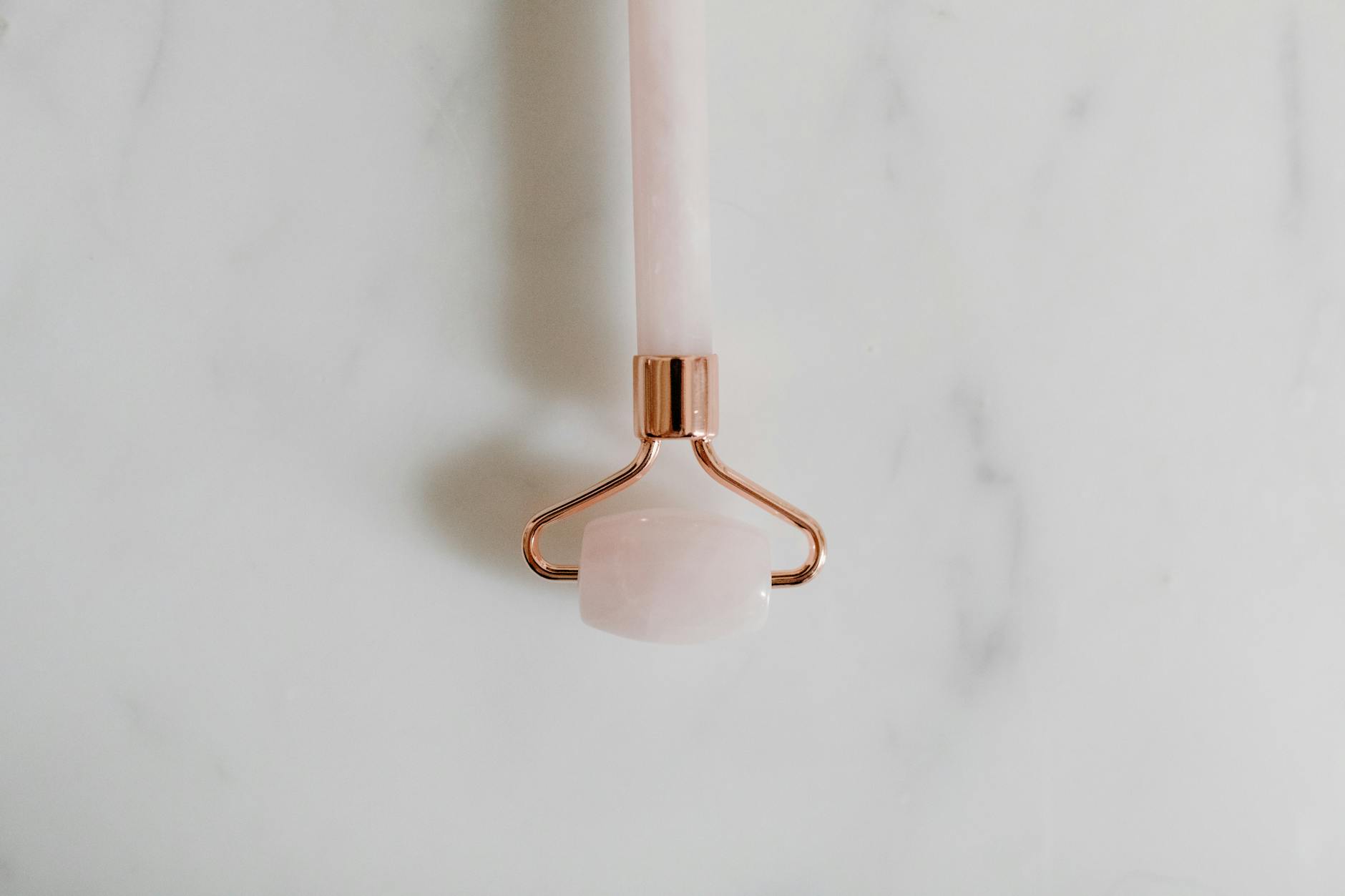 Jade roller and gua sha tools used for lymphatic drainage facial treatments
