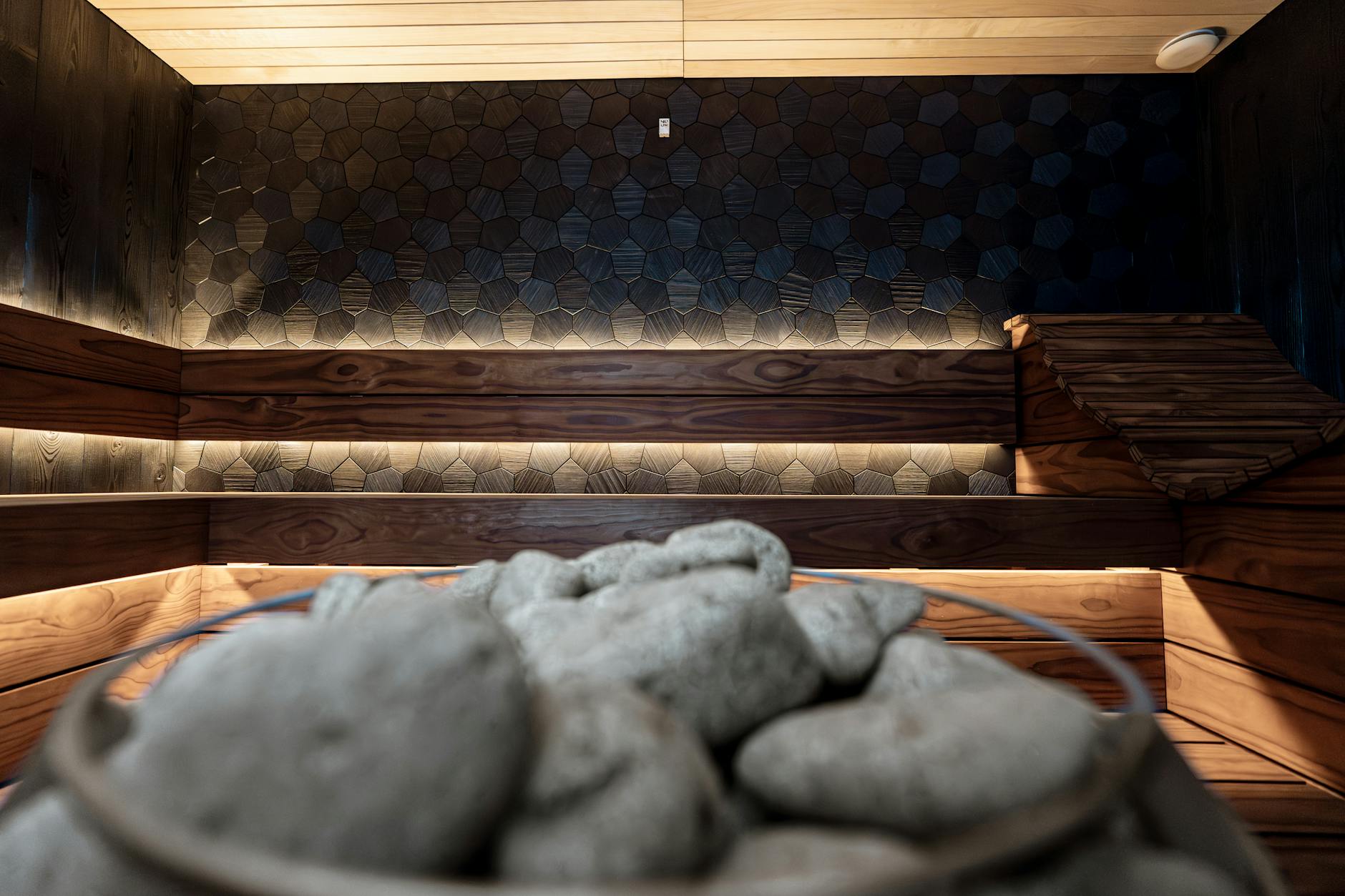 Modern spa treatment room with clean white linens and professional skincare equipment
