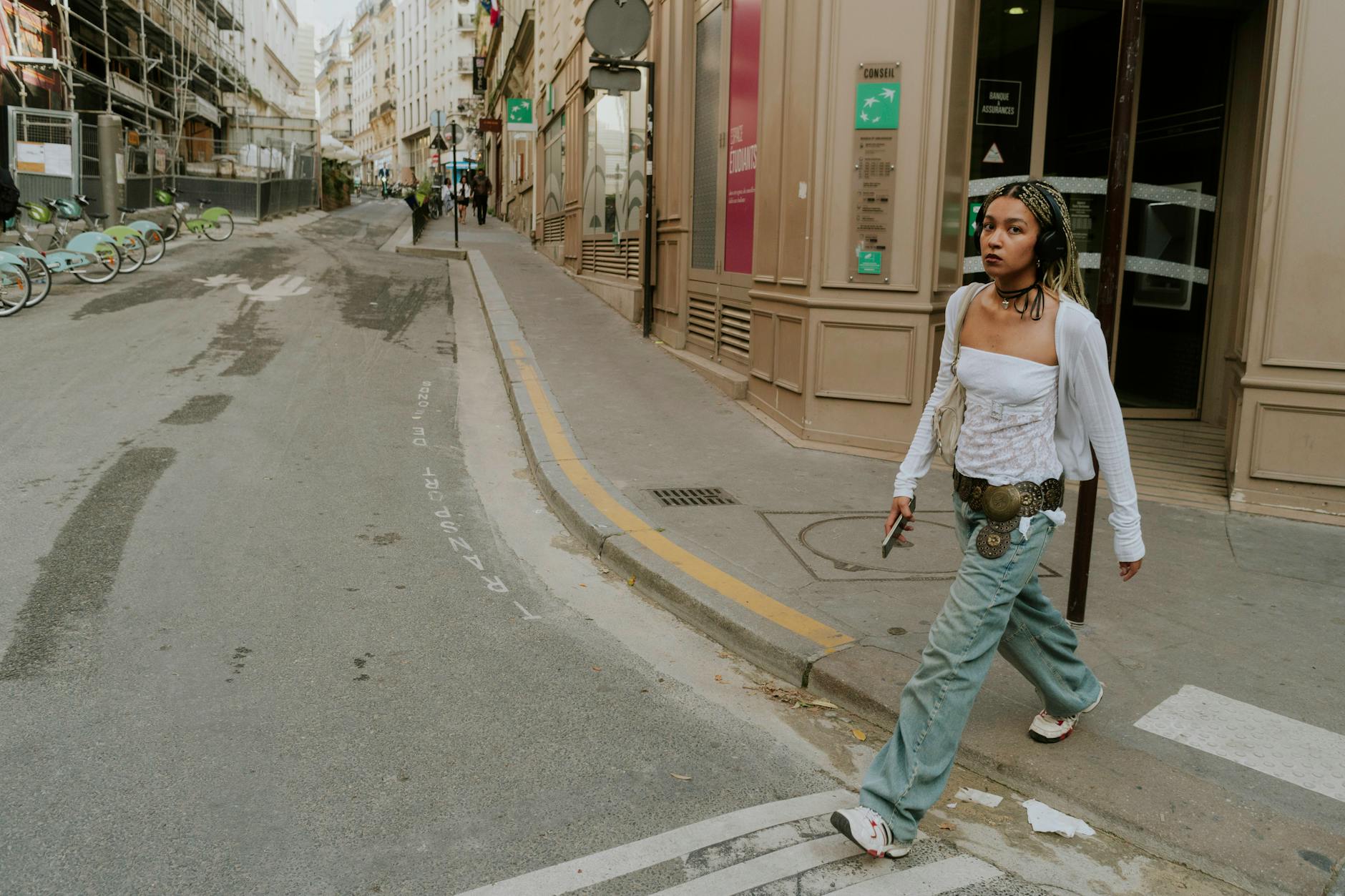 Fashion photographer capturing street style looks during fashion week events