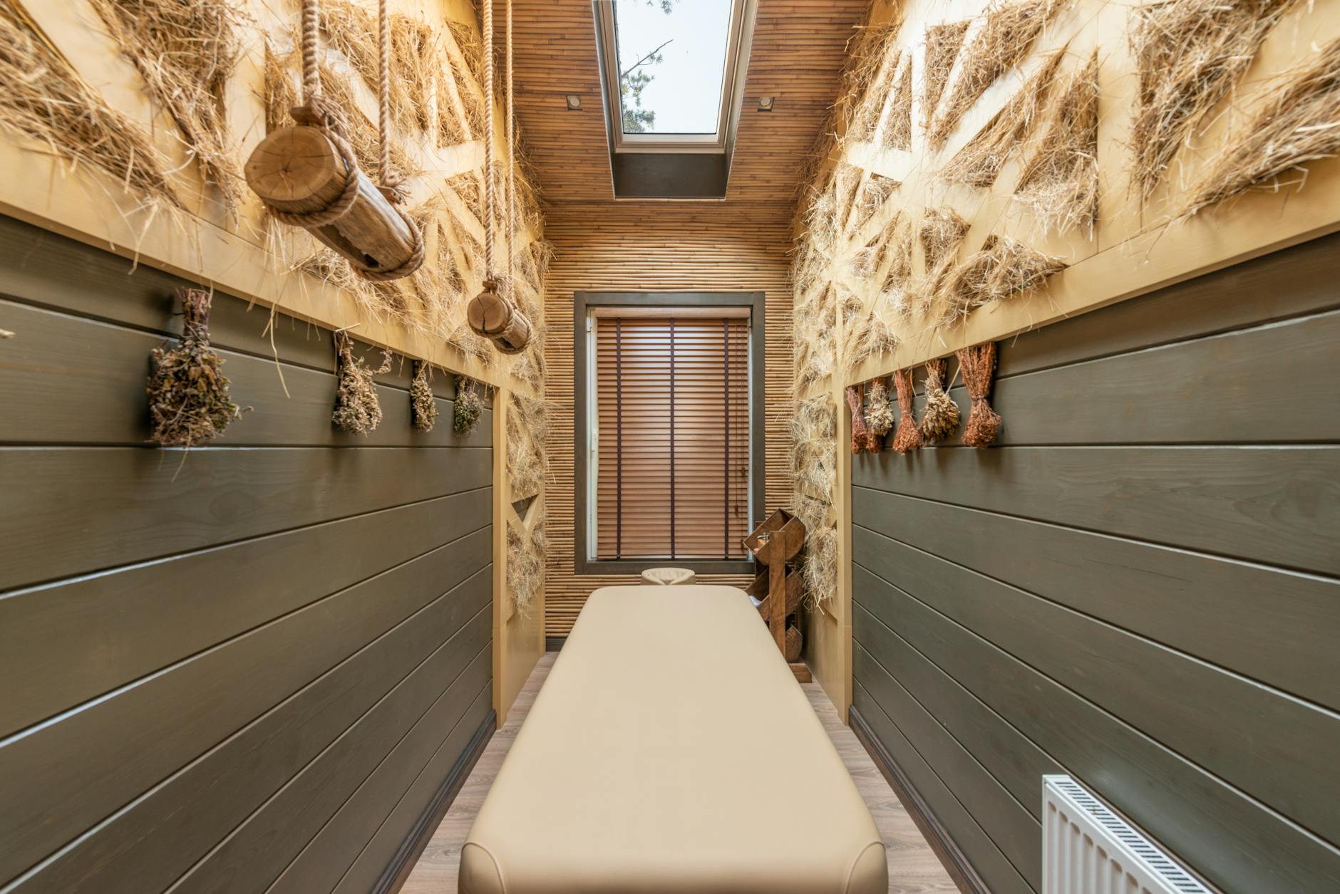 Modern spa treatment room featuring traditional Ayurvedic wellness elements