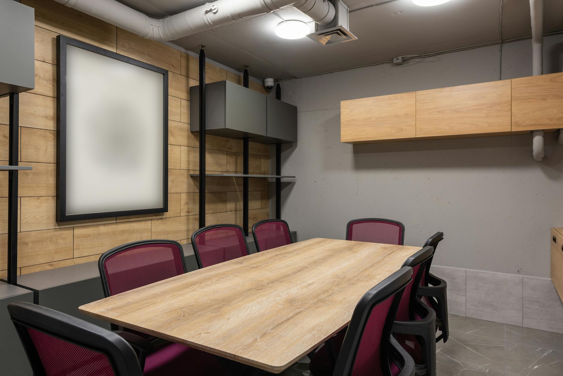 Modern corporate boardroom with large windows and meeting table