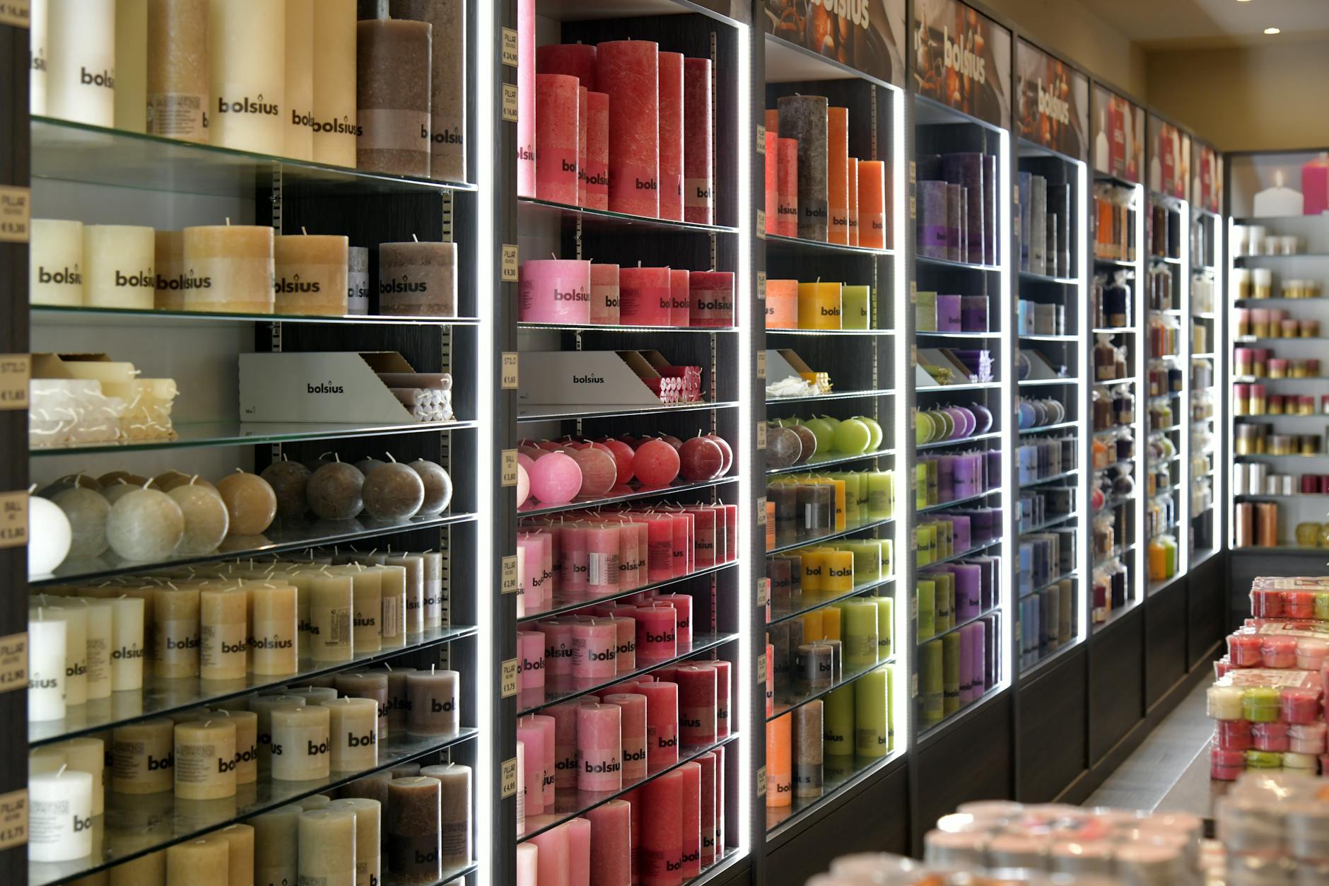 Fashion retail store interior displaying various utility-inspired clothing pieces and accessories