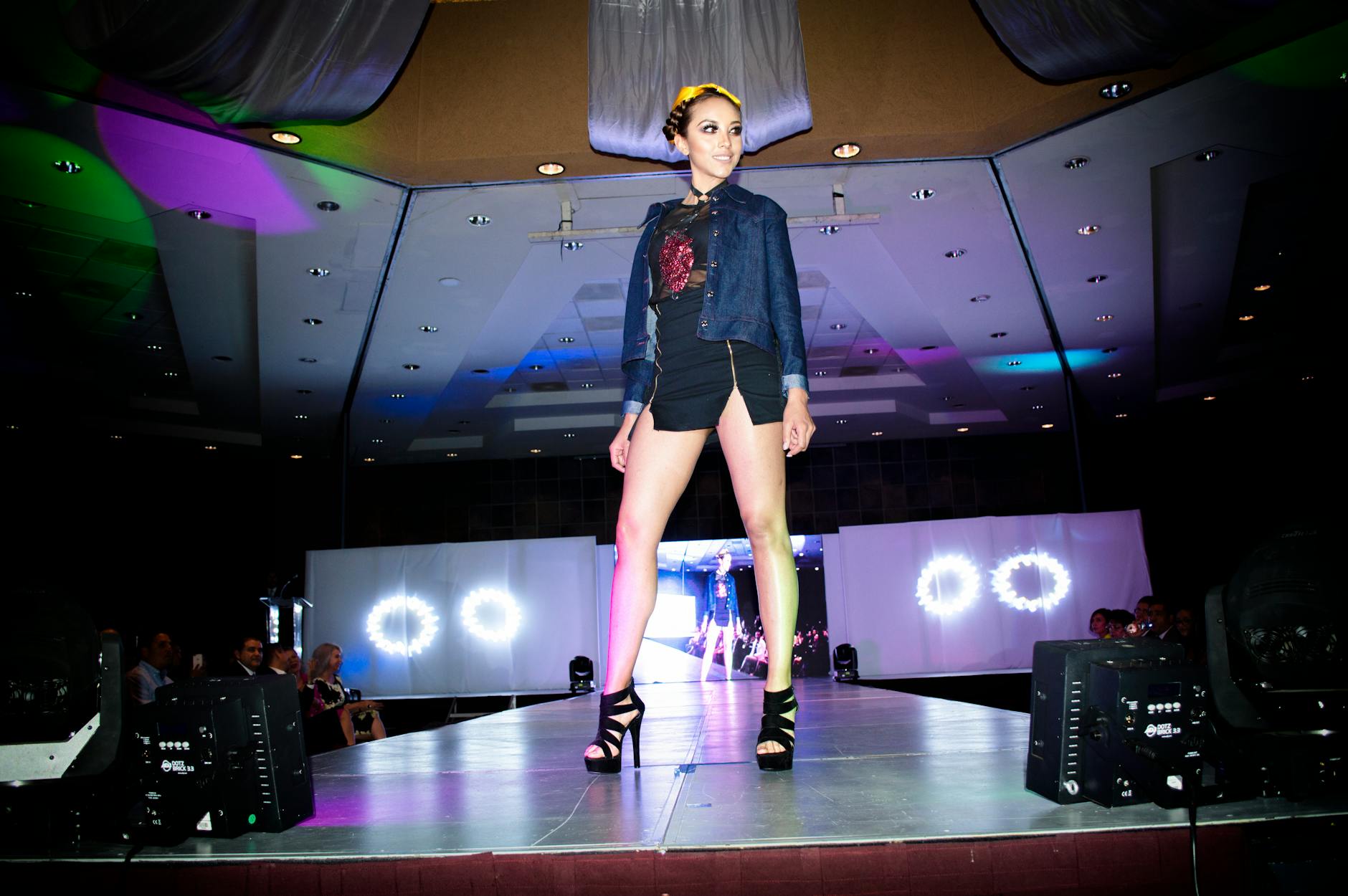 Models walking on fashion runway during student graduation show