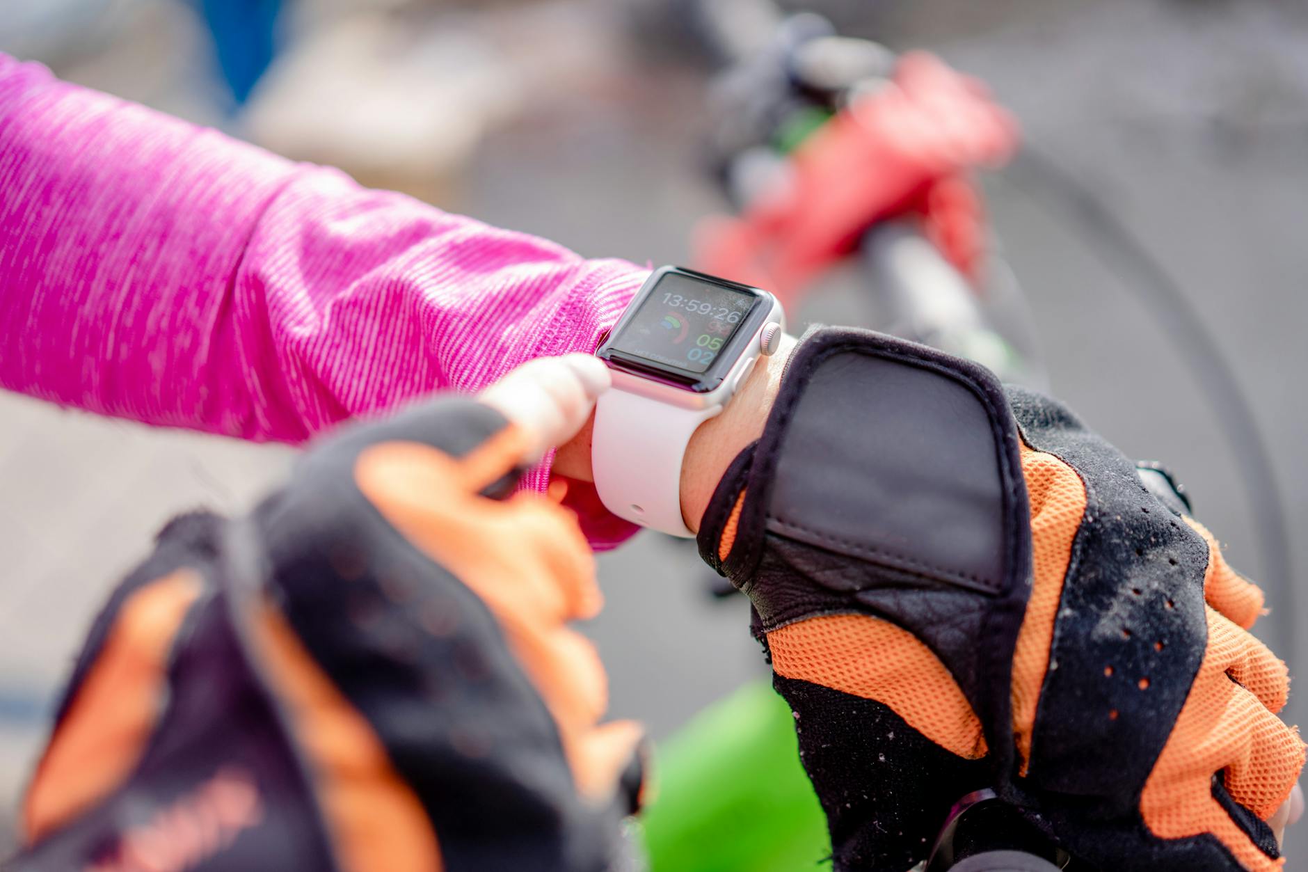 Athletic person wearing a sports watch during outdoor exercise activity