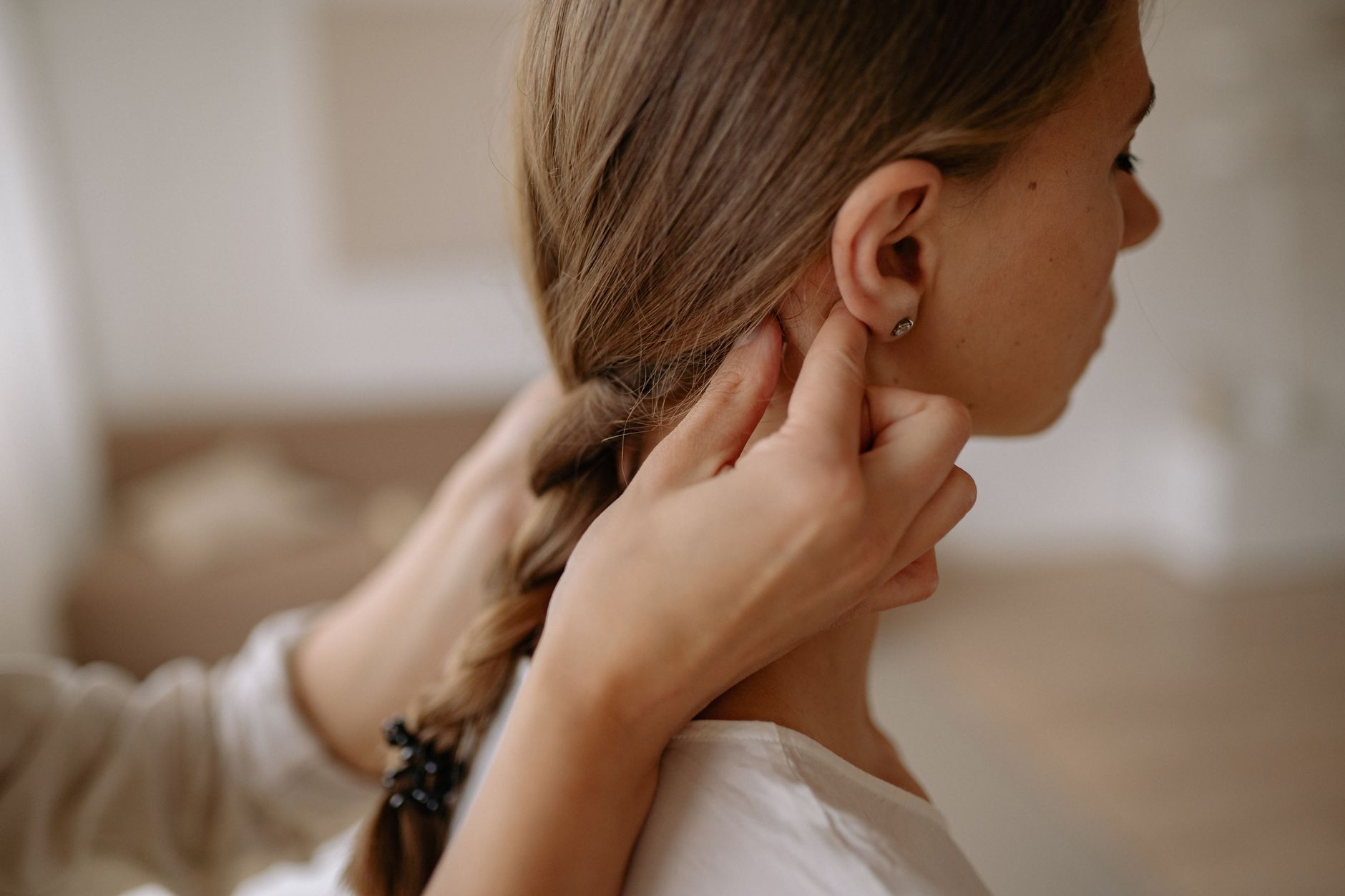 Close-up of tightly braided hair secured with small minimalist bands
