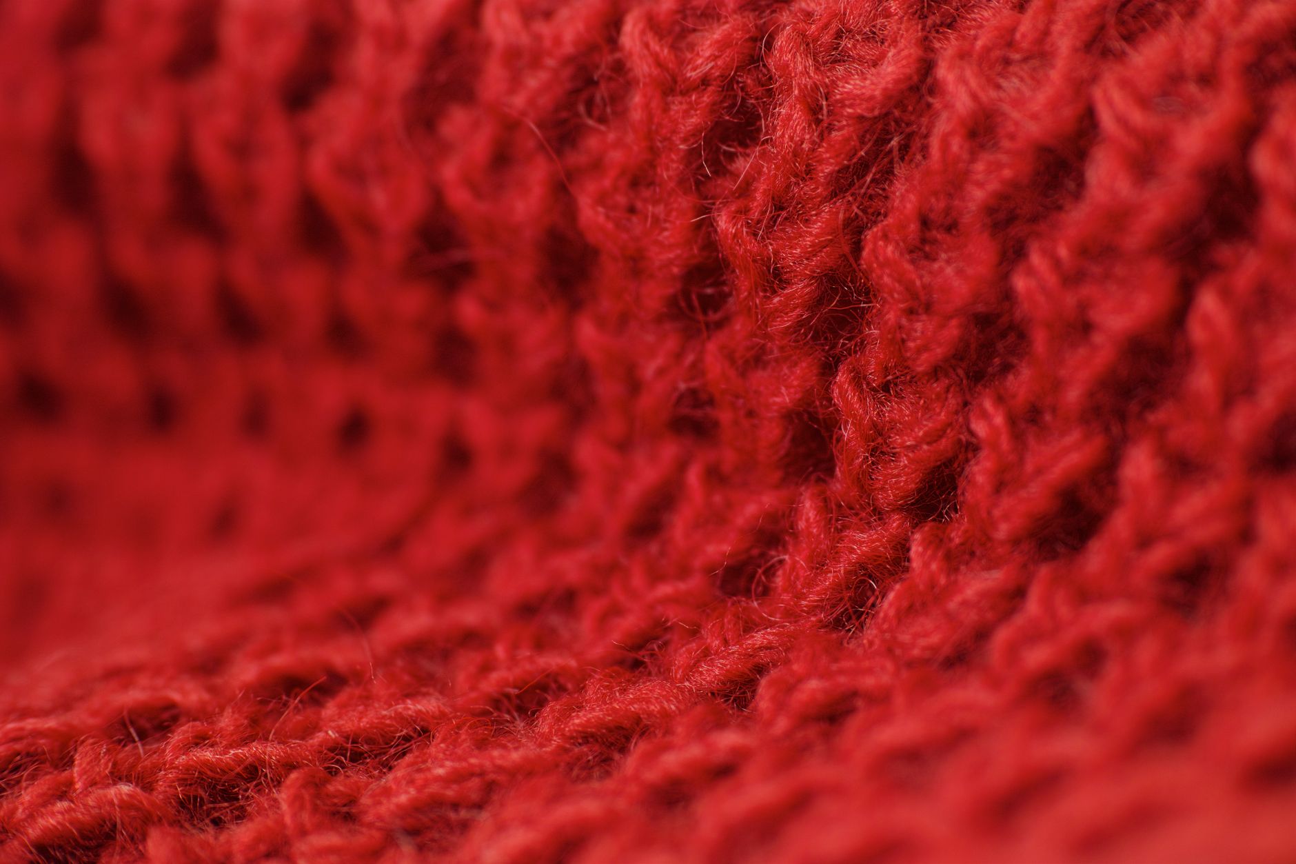 Close-up of intarsia knit detailing on a heavyweight merino pullover with stripe pattern