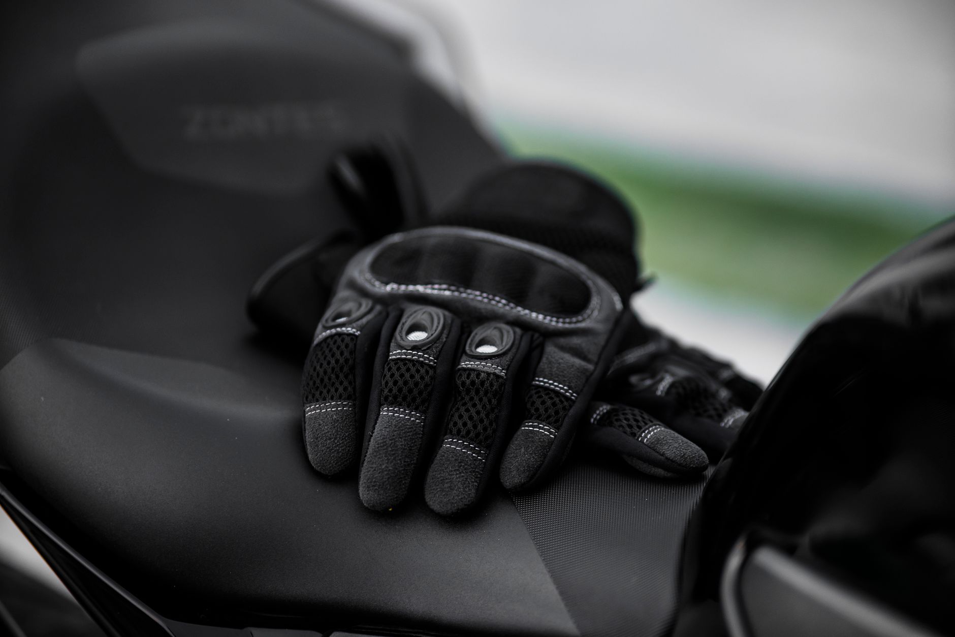 Close-up of tan cabretta leather polo riding gloves with snap closure detail