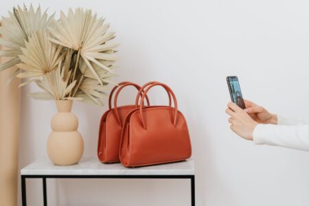 Structured luxury leather handbag with equestrian-inspired hardware detailing