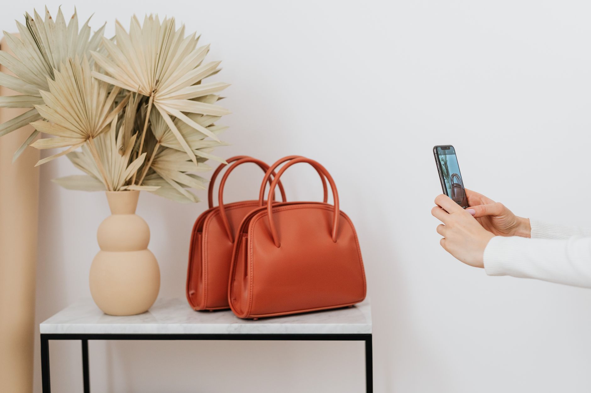 Structured luxury leather handbag with equestrian-inspired hardware detailing