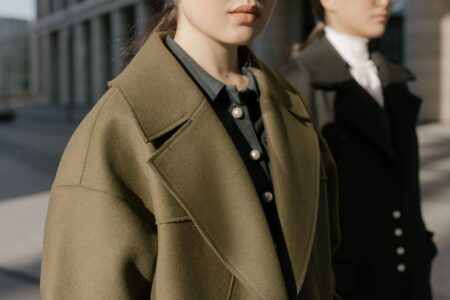 A close-up of a stiff, architectural standing collar on a tailored garment