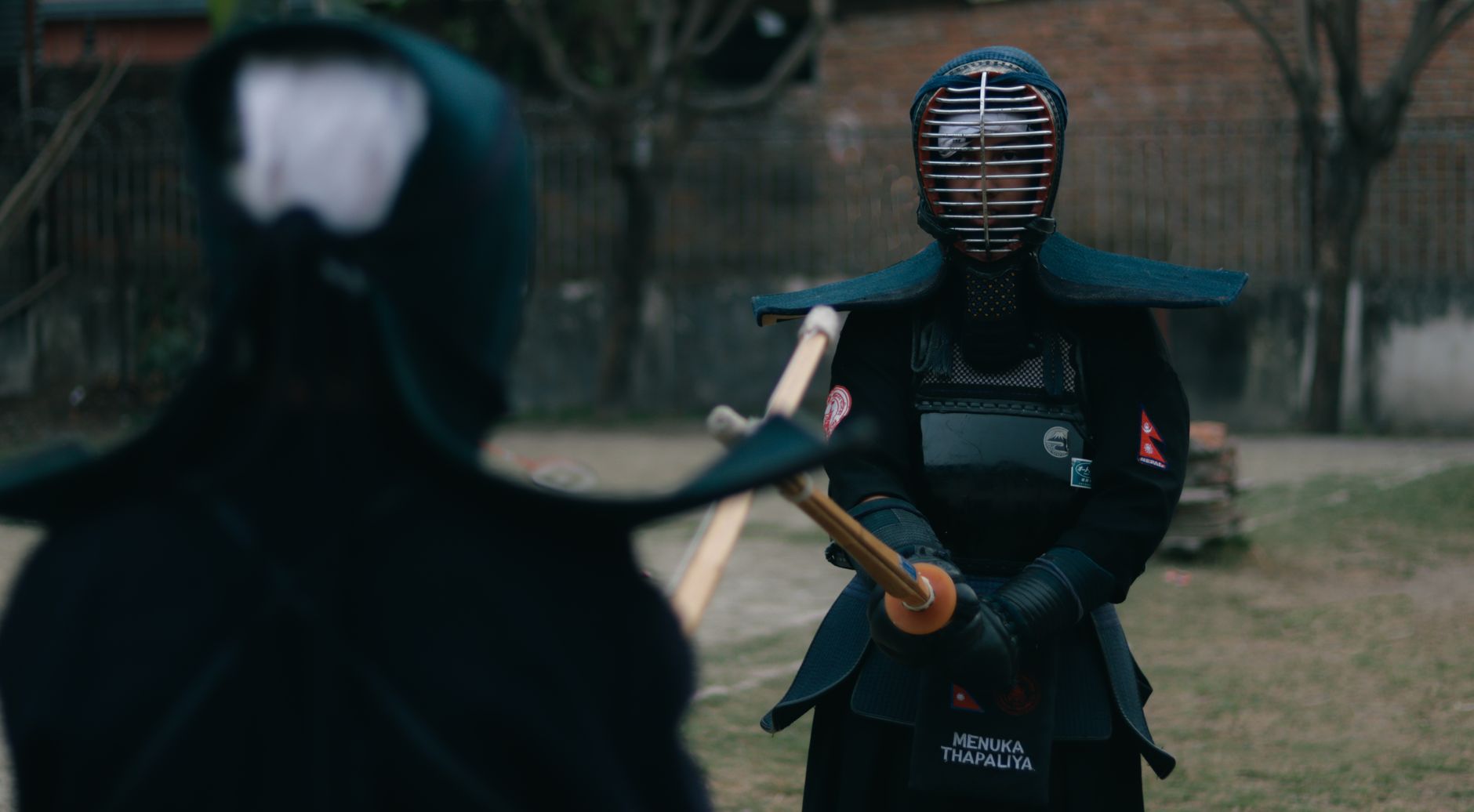 Traditional Japanese kendo bogu armour displayed showing segmented chest plate and lacing detail