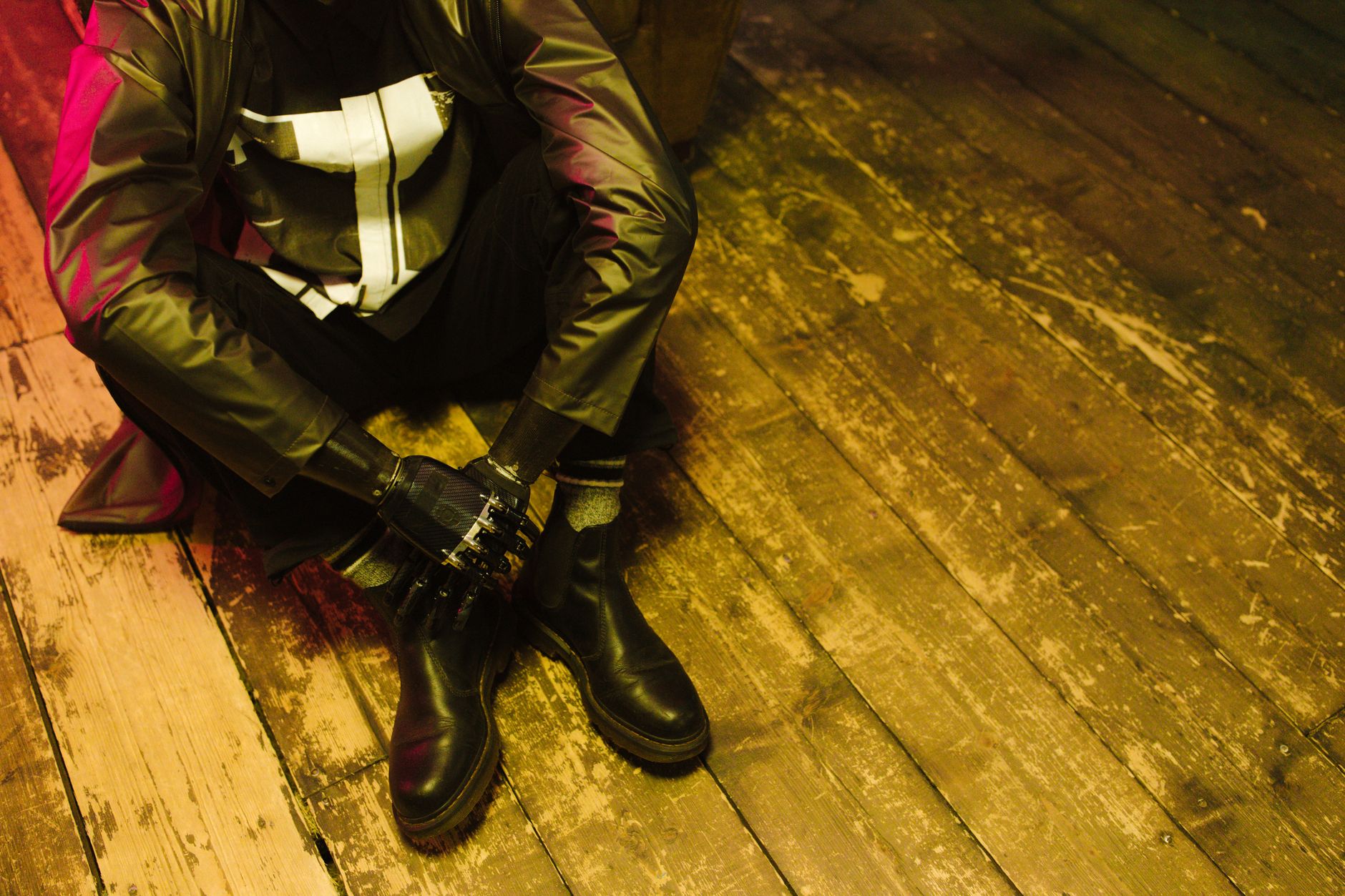 Close-up of structured leather gauntlet gloves with visible stitching and extended cuffs