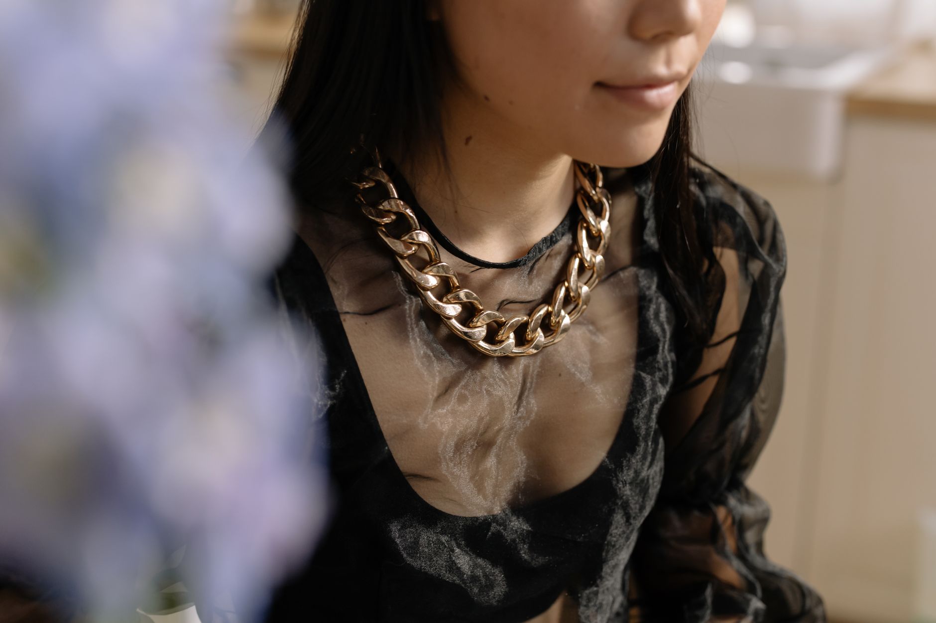 Detailed enamel pin jewellery pieces arranged on a neutral background showing layered circular designs