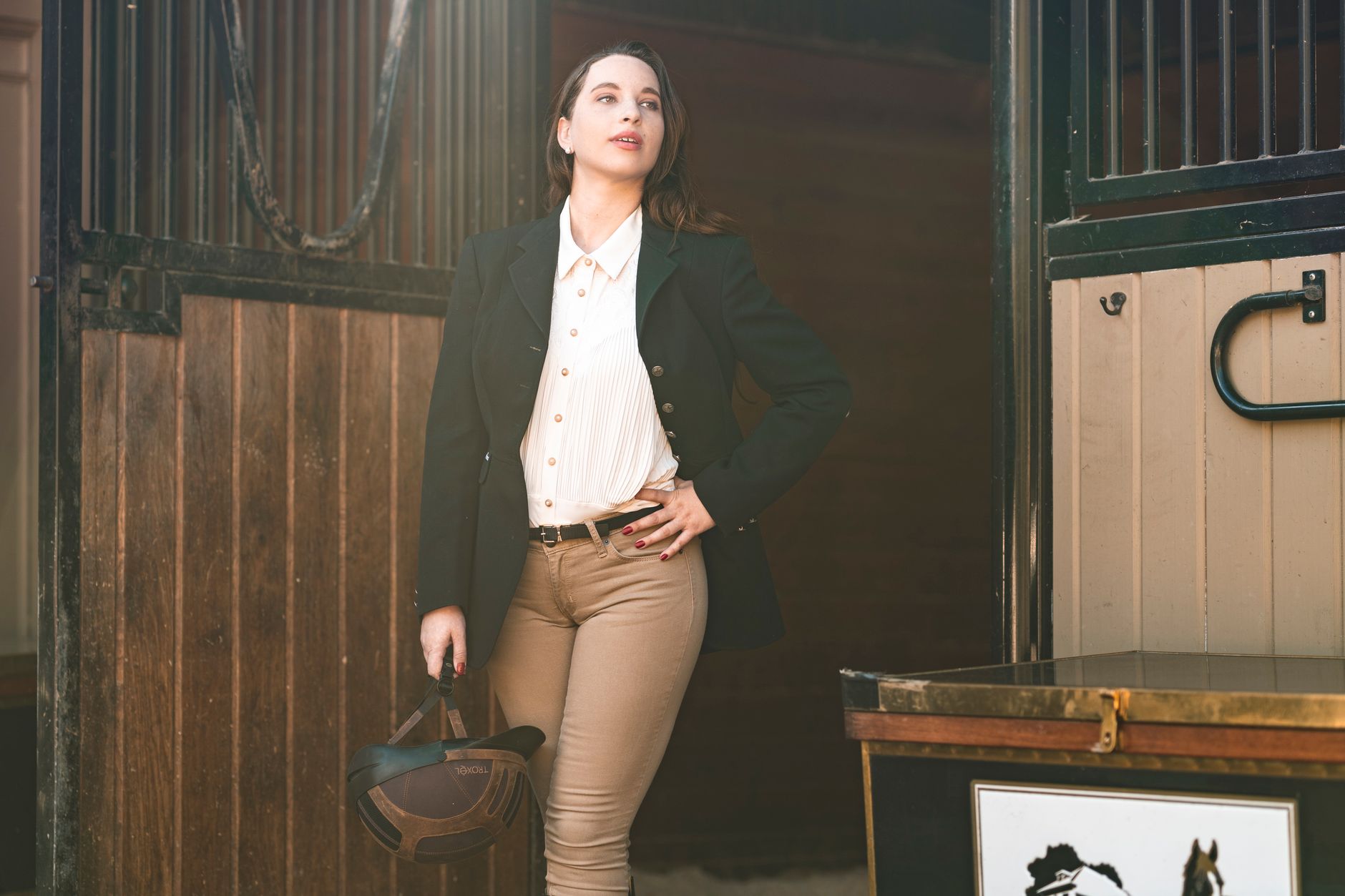 Equestrian-inspired fashion accessories laid out in a clean editorial styling shot