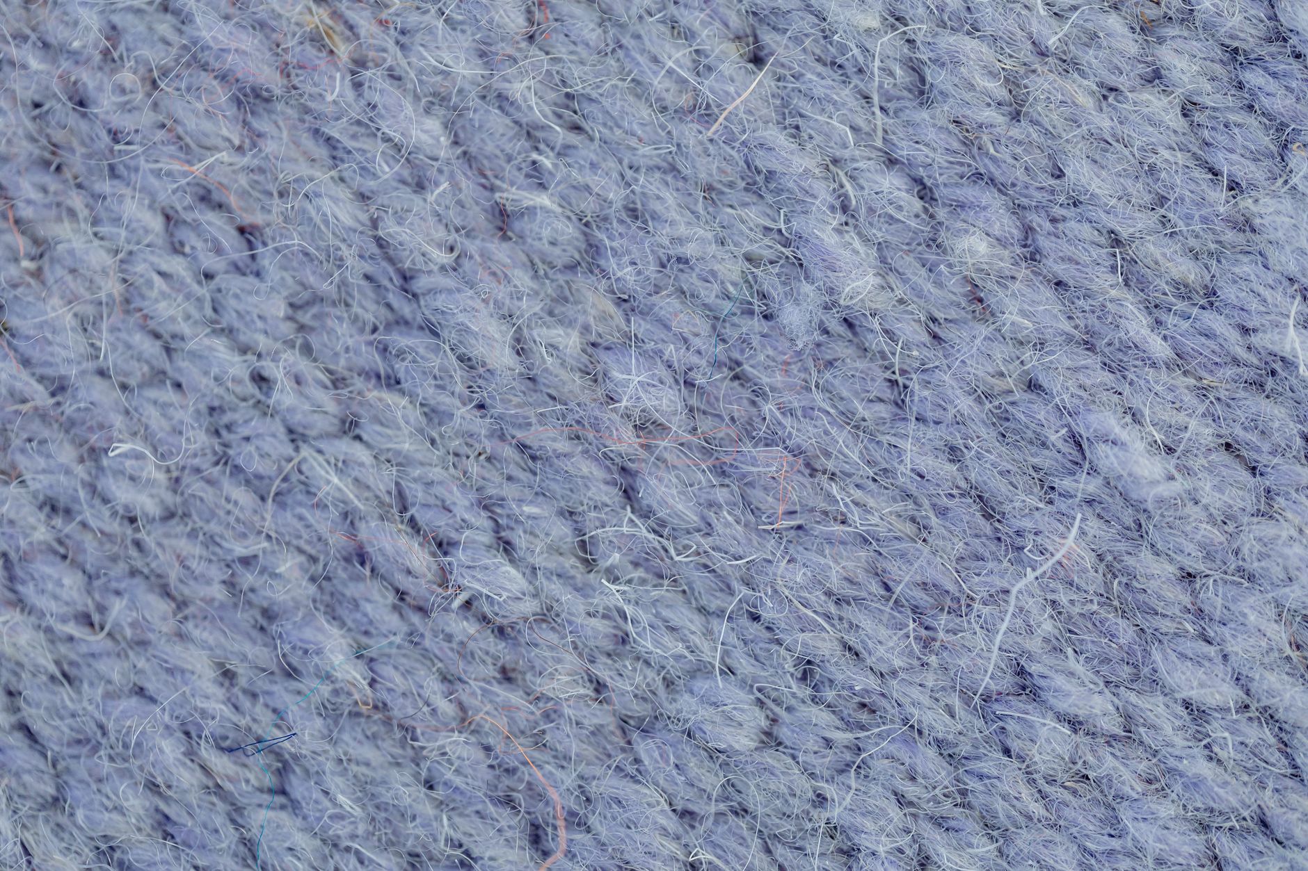 Close-up of heavy wool fabric texture used in structured trouser construction