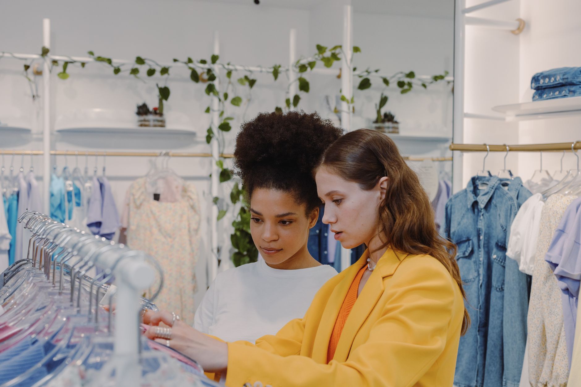 Interior of a minimalist concept fashion boutique displaying avant-garde clothing pieces