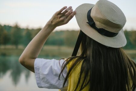 Eton College Boater Hat Ribbons Are Quietly Binding Minimalist Headbands Close-up of a classic straw boater hat with grosgrain ribbon band in striped colors