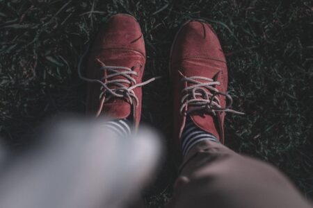 Eton College Sock Garters Are Quietly Gripping Minimalist Leg Bands Close-up of knee-length dress socks with a narrow elastic leg band visible below a trouser hem