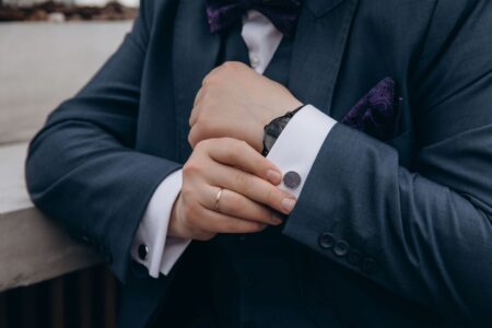 Eton College Tails Coat Sleeve Buttons Are Quietly Detailing Minimalist Cuff Hardware Close-up of a tailored suit jacket sleeve showing uniform button placement along the cuff edge
