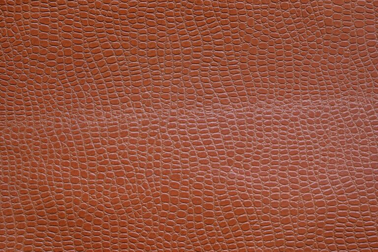 Close-up of pebbled saddle seat leather surface showing natural grain and matte finish