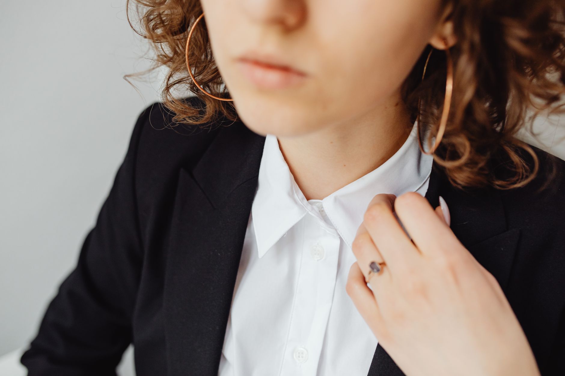 Tailored outerwear coat with structured collar and piped neckline detail