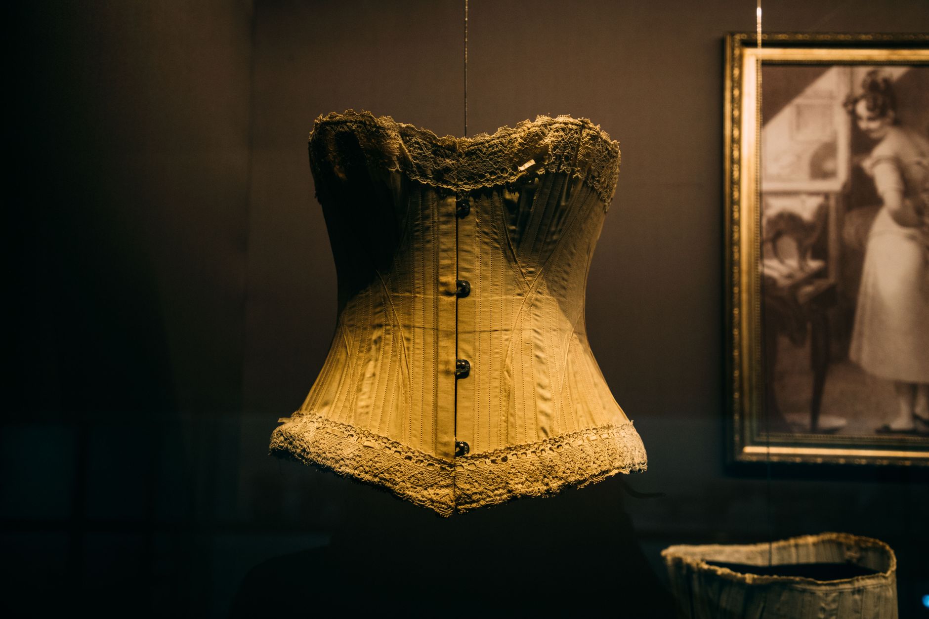 Detail shot of structured corset boning and front panel construction on a fashion garment