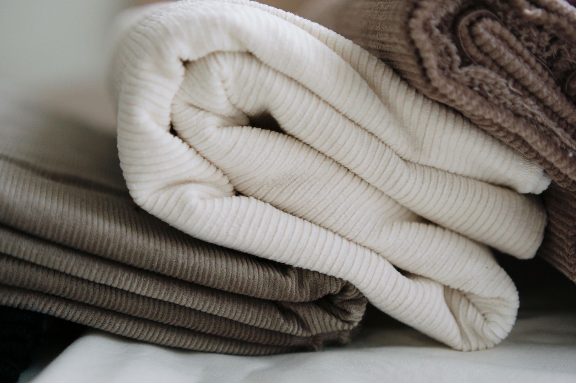 Rich velvet fabric with visible pile texture in warm tone
